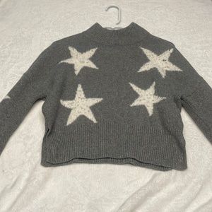Cropped grey sweater with white stars on it in a size xs